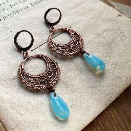 Copper Filigree Earrings With Blue Glass Teardrops..